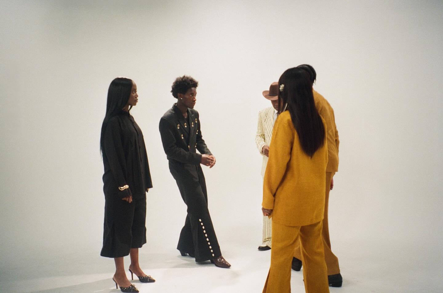The cast enters the frame